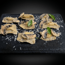 Foto de Raviolli de poro parmesano con salsa de hongos