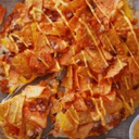 Foto de Panceta, cheddar y nachos de queso