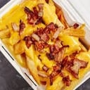 Foto de Porcion de papas fritas + cheddar + bacon