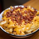 Foto de Papas Fritas Cheddar + Bacon