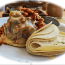 Foto de Volcan: Montaña de carne exclusivamente de pastor cubierto de queso manchego