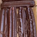 Foto de 6 churros bañados y rellenos 