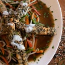 Foto de Salmón rosado en sésamo con vegetales al wok