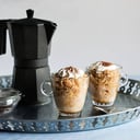 Foto de Dos capuchinos , dos muffins y dos almojabanas