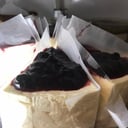 Foto de Porción cheescake frutos rojos