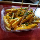 Foto de Papas grande con cheddar y verdeo.