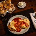 Foto de milanesa de ternera napolitana (con guarnición)