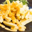 Foto de Papas fritas con queso cheeddar
