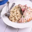 Foto de Chuleta de cerdo marinada con aji de color a la plancha, con arroz pilaf.