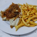 Foto de Milanesa de pollo fugazzeta con guarnicion