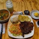 Foto de menú casero martes :sopa de arracacha, arroz, carne asada, papa salada ensalada roja, jugo/dulce 