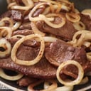 Foto de menú casero viernes .sopa de guineo ,arroz verde, carne en cebolla frijol ,papa salada ensalada jugo/dulce