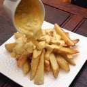 Foto de PAPAS RUSTICAS CON PANCETA Y QUESO CHEDDAR