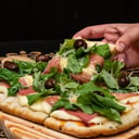 Foto de Jamón crudo , rúcula y queso 