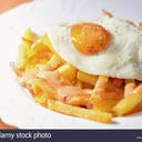 Foto de Papas + Huevo Porción: Grande