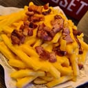 Foto de Con cheddar, panceta verdeo y huevo