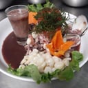Foto de Pescado con conchas negras 