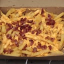 Foto de Papas con cheddar y bacon