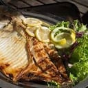Foto de Pacú a la parrilla con con guarnición 