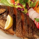 Foto de Mojarra Frita (Mediana)  "Servido con ensalada verde, papas a la francesa y arroz  