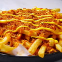 Foto de Patatas fritas con queso cheddar fundido y serrano bites