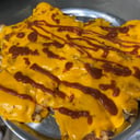 Foto de Milanesa con cheddar y barbacoa + guarnición