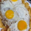 Foto de Milanesa a caballo + guarnicion