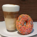 Foto de Cafe grande + dona con dulce de leche / coffee with milk + donut with dulce de leche