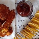 Foto de Pechuguitas Crispy + papas fritas