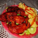 Foto de Alitas con papas de hojuela