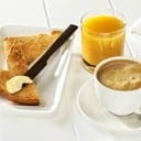 Foto de Tostada + Café + zumo de naranja 