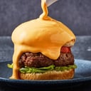 Foto de Baño de Queso Cheddar Cremoso a tu Hamburguesa