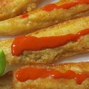 Foto de Tiras de pescado rebozado (4 pza) con ensalada 