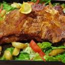 Foto de vacio a la parrilla con papas fritas