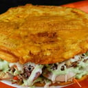 Foto de Patacón (Twice-fried Plantain Slices, with chicken, beef or pork)