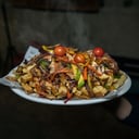 Foto de Papas Rusticas: Con Verduras Salteadas