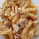 Foto de Porción de papas fritas con huevos revueltos
