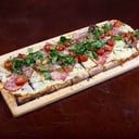 Foto de Porción de pizza muzza + 2 gustos