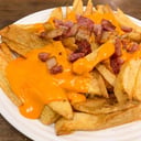 Foto de Papas Fritas c/ Cheddar y Panceta
