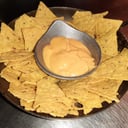 Foto de Nachos con Cheddar o Salsa brava (picante)