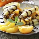 Foto de Crepe de durazno con chocolate y crema chantilly