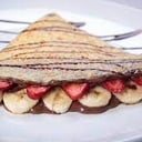 Foto de Crepe de fresas y banano con nutella