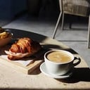 Foto de COMBO 6: Cafe con leche y croissant relleno de jamón y queso.