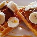 Foto de Waffles relleno con dulce de leche y banana.