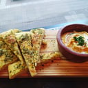 Foto de Hummus con pan de pizza