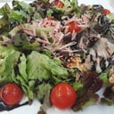 Foto de Ensalada de frutos secos y virutas de foie con salsa de frutos rojos