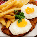 Foto de Milanesa a caballo con papas fritas
