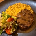 Foto de Filete de Res con Mote de Trigo al Ají con Mini Ensalada             