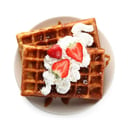 Foto de Exquisitos waffles con helado a eleccion , crema chantillí , frutillas y salsa a elección