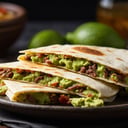 Foto de Quesadillas carne, queso, acompañada de guacamole (Proximamente)